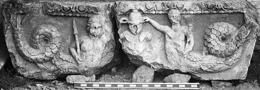 Fig. 3. Frieze block from the Arch of Augustus with relief depicting Tritons flanking trophies (G.R. Swain, archive photograph, 1924, no. 7.1391, Pisidian Antioch excavation archive, Kelsey Museum of Archaeology, University of Michigan; courtesy Kelsey Museum of Archaeology).