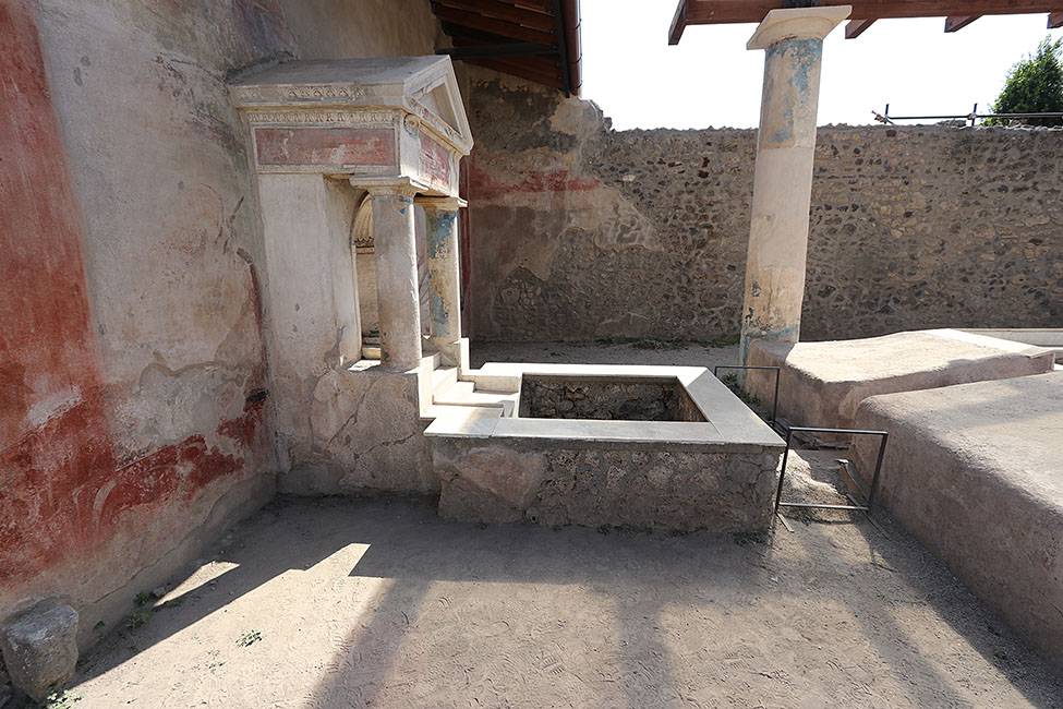 Fig. 1. Aedicular fountain, water basin, marble channel, and southern bench of the water triclinium in the Casa dell’Efebo, facing west.