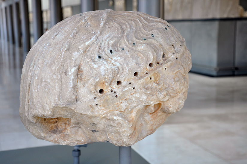 Fig. 6.  Head from east pedimental figure, once thought to be that of Helios. Athens, Acropolis Museum, inv. no. 2381.