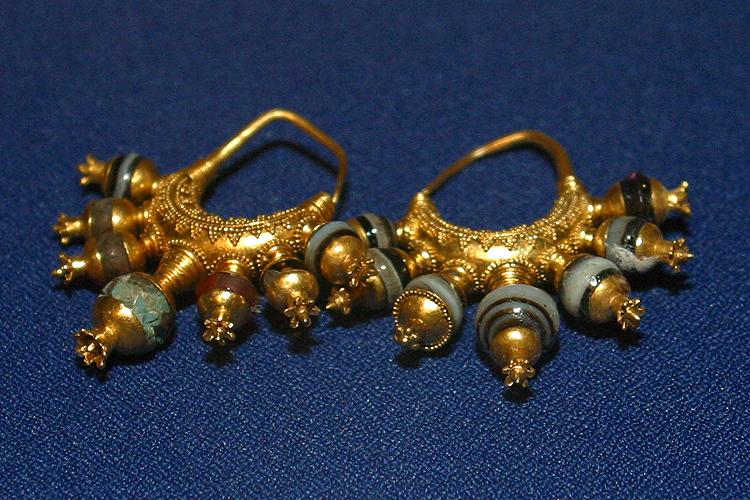 Fig. 3. Pair of earrings with pomegranate pendants, gold with beads of agate and other stone, wdth. ca. 4 cm. Tomb II, Northwest Palace, Nimrud. ND 1989.38a, b; Baghdad, Iraq Museum, inv. nos. 105821, 105822 (N.L. Feeney, 318th Public Affairs Operation Center [PAOC], U.S. Army, Baghdad 2003).