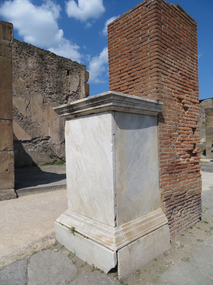 Fig. 6. Arch for the Holconii, northwestern pier with an oblique view of the statue pedestal dedicated to Marcus Holconius Rufus, Pompeii, Italy, first century C.E.