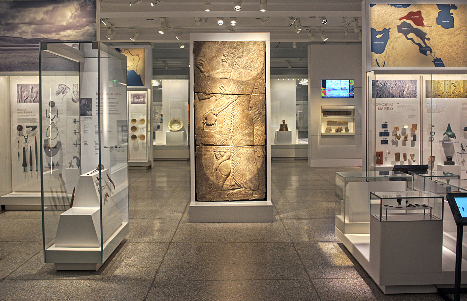 Fig. 4. In the center of the third gallery space, a monumental relief of Assyrian winged genie from the Palace of Ashurnasirpal II (r. 883–859 B.C.E.), Nimrud, Iraq (courtesy Penn Museum, Philadelphia).