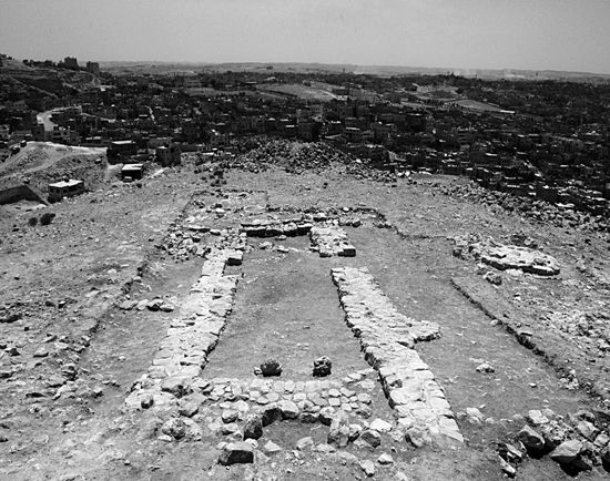 Fig. 3. Khirbet al-Batrawy. The Early Bronze II–III (2900–2300 B.C.E.) restored temple on the easternmost terrace of the site (area F), from the west in 2009. In the foreground is the Early Bronze III (2700–2300 B.C.E.) horseshoe-shaped niche with the couple of betyls facing it.