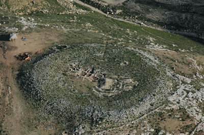 Fig. 3. "Conder's Circle" in a steep-sided valley just south of Khirbet el-Mukhayat and 6.25 km west-northwest of Madaba. The excavators date it to the Late Chalcolithic/Early Bronze Age and regard it as unique. The narrow dividing wall is a Byzantine boundary wall unrelated to the original structure.