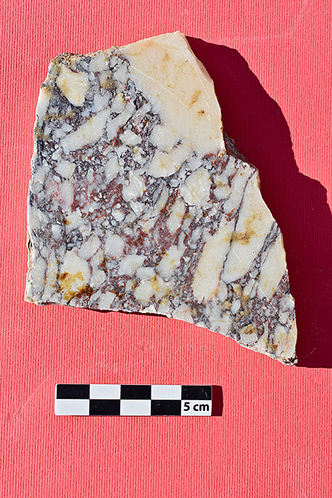 Fig. 16. A selection of marble wall veneer fragments from the heated rooms: a, bigio morato; b, giallo antico brecciato; c, pavonazzetto; d, portasanta; e, verde antico.
